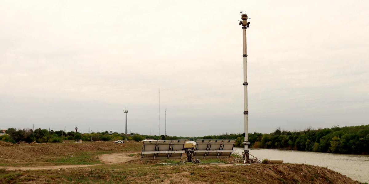 photo of a surveillance tower next to a body of water